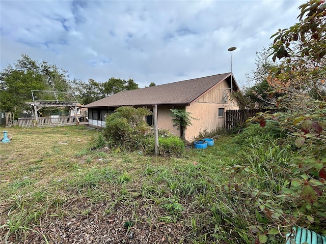 view of side of property with a lawn