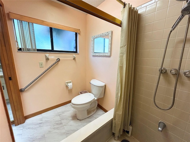 bathroom featuring toilet and a shower with shower curtain