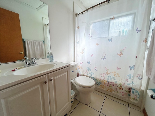 full bathroom with tile patterned floors, toilet, vanity, and shower / bath combo