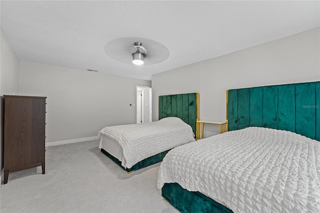 bedroom featuring ceiling fan and light carpet