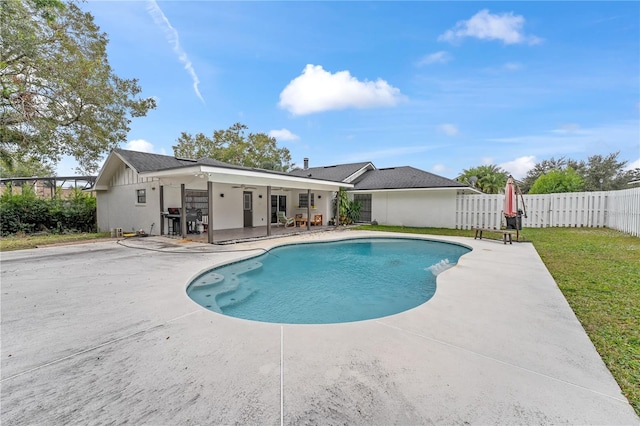 view of swimming pool with a patio area, ceiling fan, and area for grilling