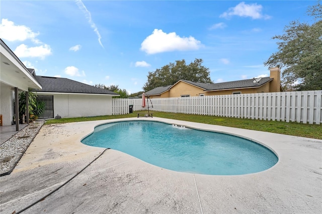 view of swimming pool featuring a patio area