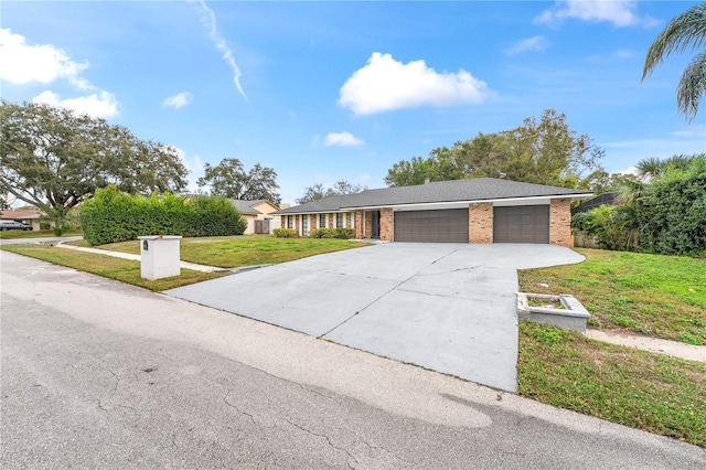 single story home with a garage and a front yard