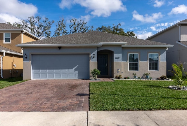 single story home featuring a front yard and a garage