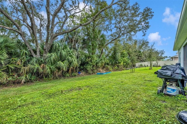 view of yard with fence