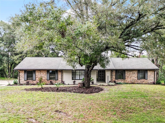 ranch-style house with a front yard