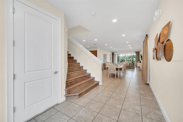 stairway with tile patterned flooring