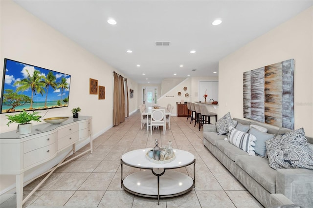 living room with light tile patterned flooring