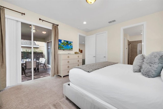 carpeted bedroom with access to exterior and connected bathroom