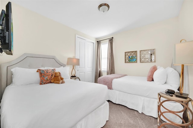 carpeted bedroom with a closet