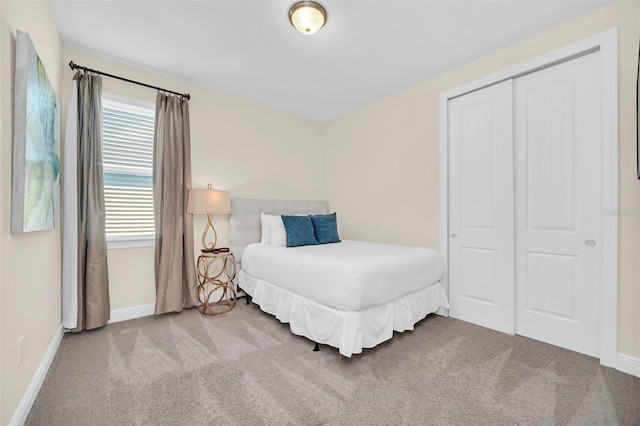 carpeted bedroom featuring a closet