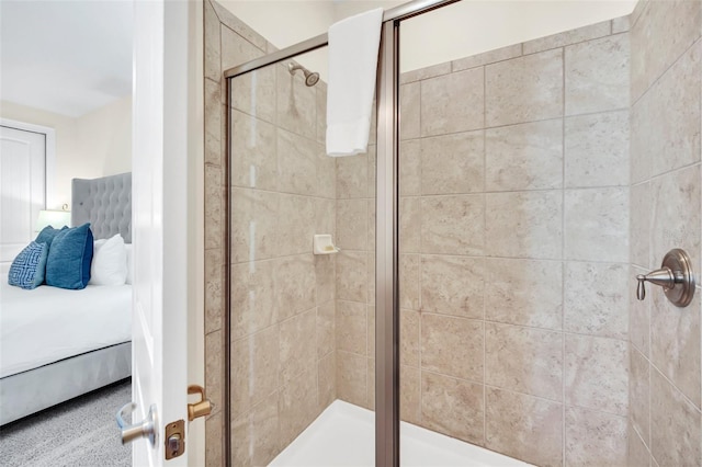 bathroom featuring a shower with door