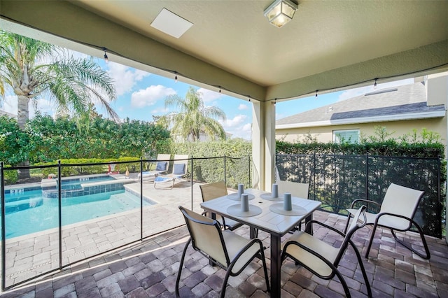 view of patio featuring a pool with hot tub