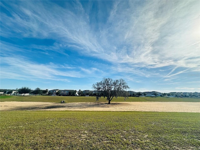 view of yard with a rural view