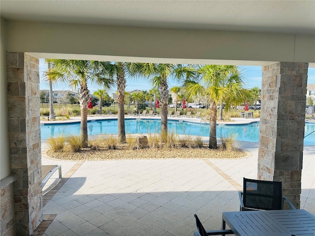 view of swimming pool with a patio