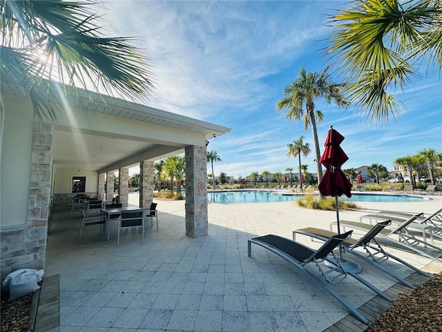 view of patio with a community pool