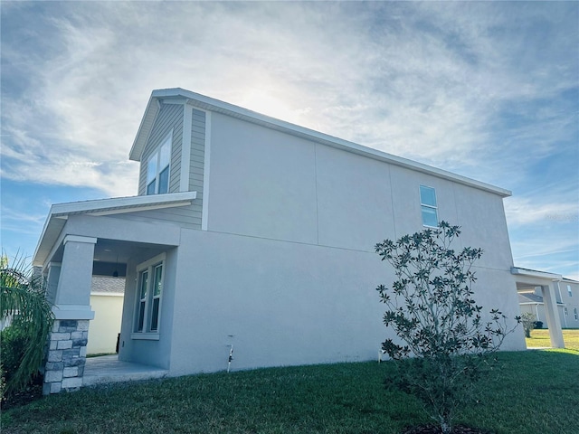 view of home's exterior featuring a lawn