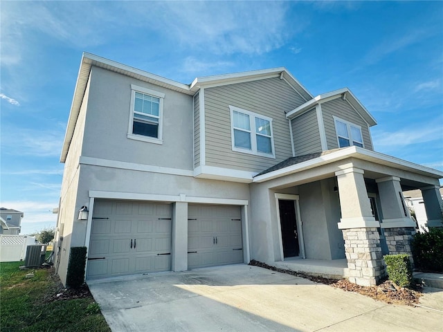 view of front of home featuring central AC unit and a garage