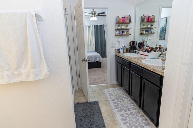 bathroom featuring tile patterned floors, ceiling fan, and vanity