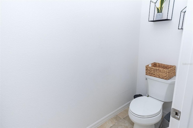 bathroom featuring tile patterned floors and toilet