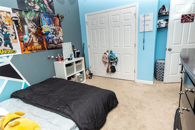 bedroom with light carpet and a closet