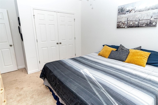 carpeted bedroom featuring a closet