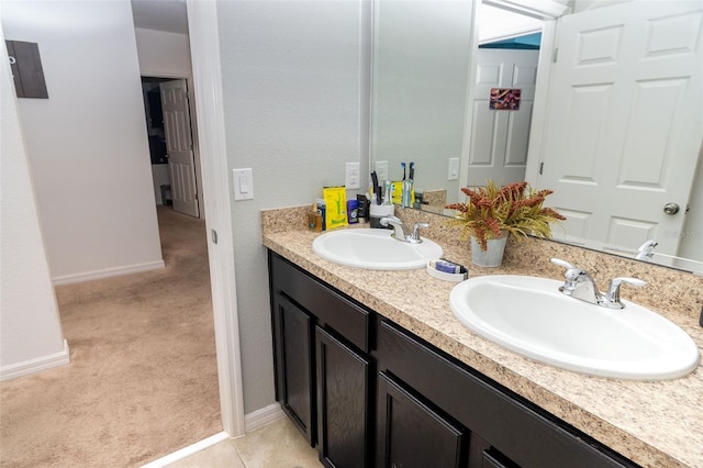 bathroom featuring tile patterned flooring and vanity