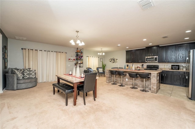 carpeted dining room with a notable chandelier