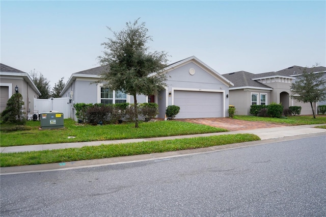 view of front facade with a front yard and a garage