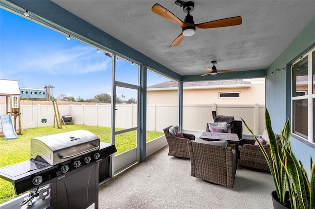 sunroom / solarium with ceiling fan