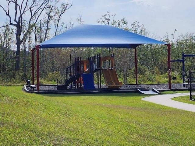 view of jungle gym featuring a yard