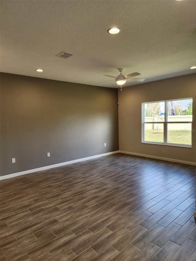 spare room featuring a textured ceiling and ceiling fan