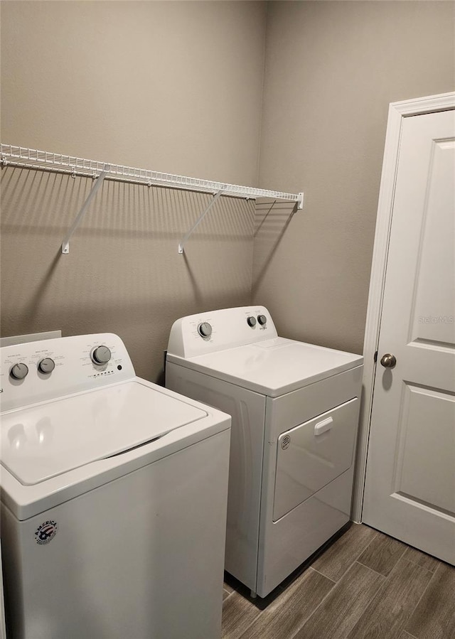 clothes washing area featuring washing machine and dryer