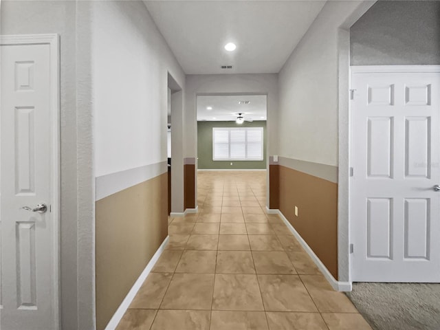 hallway with light tile patterned flooring