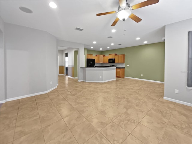 unfurnished living room with ceiling fan and light tile patterned floors