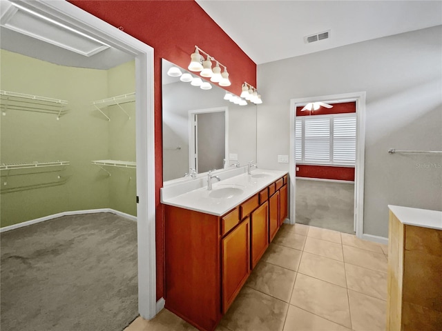 bathroom featuring tile patterned flooring and vanity