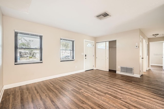 interior space with dark hardwood / wood-style flooring