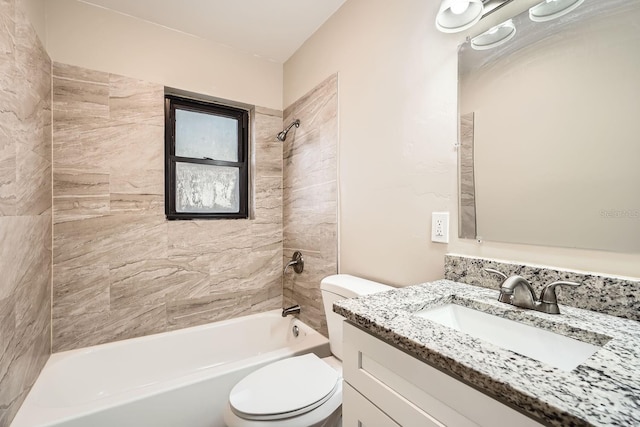 full bathroom with toilet, vanity, and tiled shower / bath combo