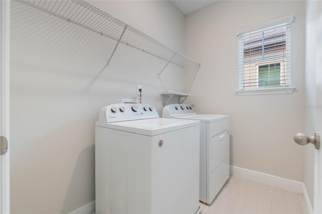 laundry room with washer and clothes dryer