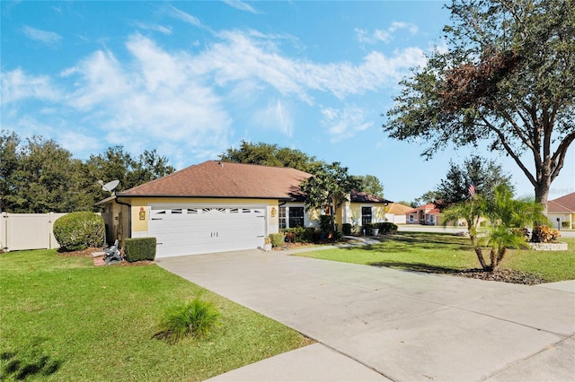 ranch-style house with a garage and a front lawn