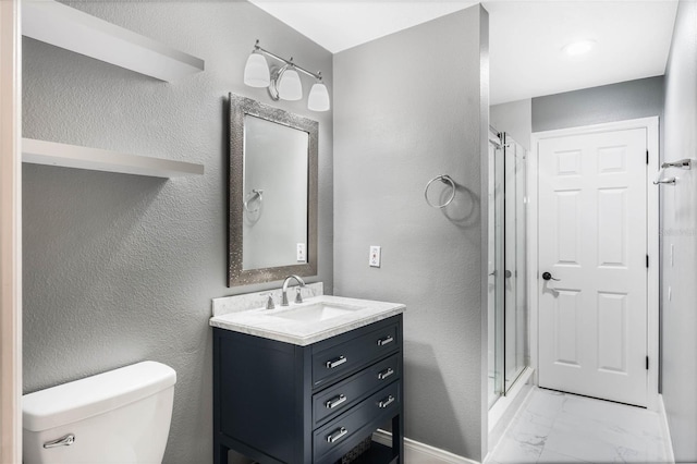 bathroom featuring walk in shower, vanity, and toilet