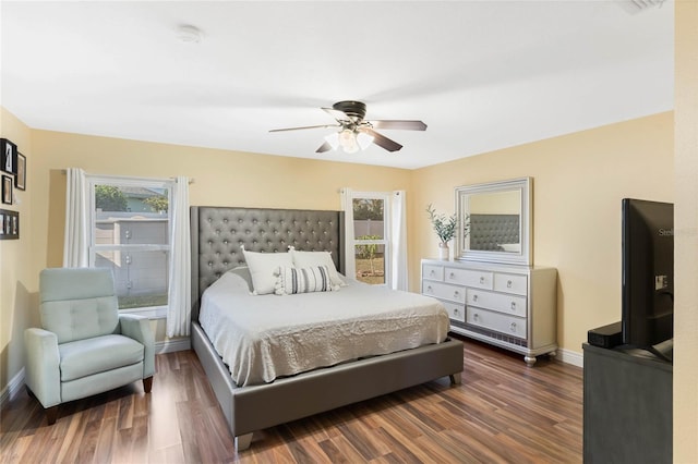 bedroom featuring ceiling fan and dark hardwood / wood-style floors