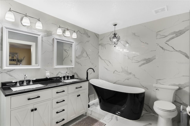 bathroom featuring a bath, vanity, and toilet