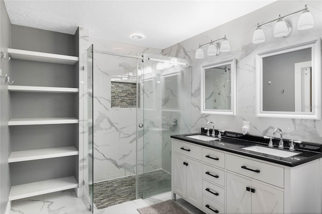 bathroom featuring vanity and an enclosed shower