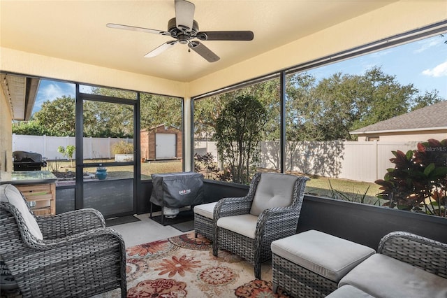 sunroom / solarium with ceiling fan and a healthy amount of sunlight