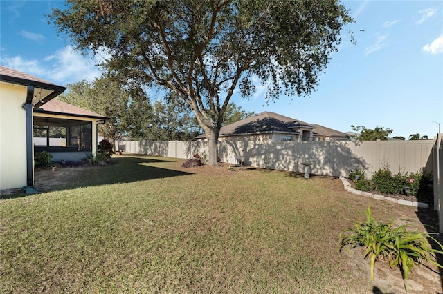 view of yard with a sunroom