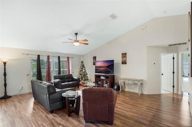 living room featuring hardwood / wood-style floors, ceiling fan, and lofted ceiling