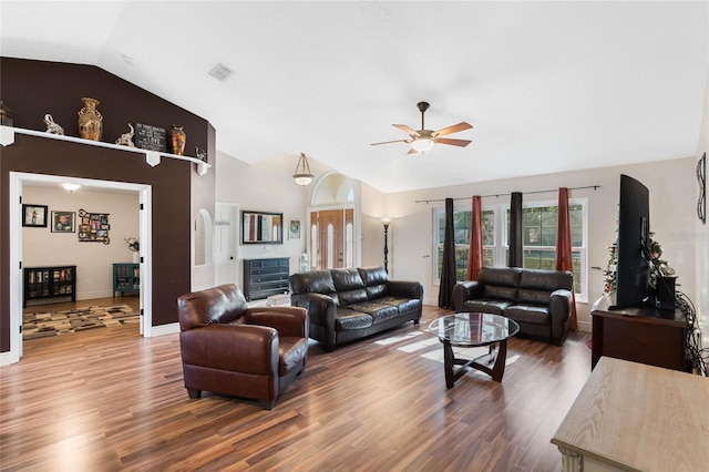 living room with ceiling fan, wood-type flooring, and lofted ceiling