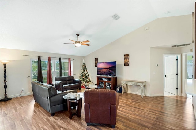 living room with ceiling fan, wood-type flooring, and lofted ceiling