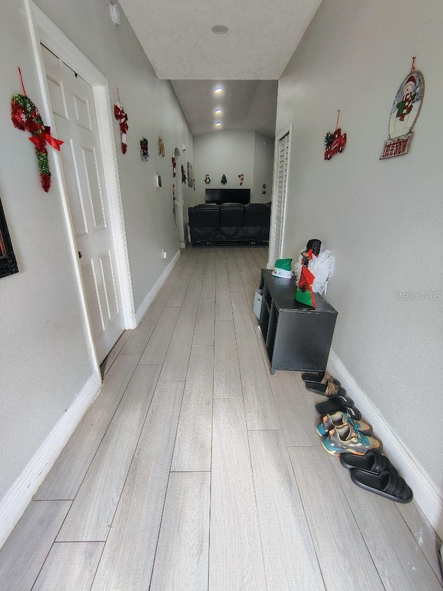 hallway with light wood-type flooring